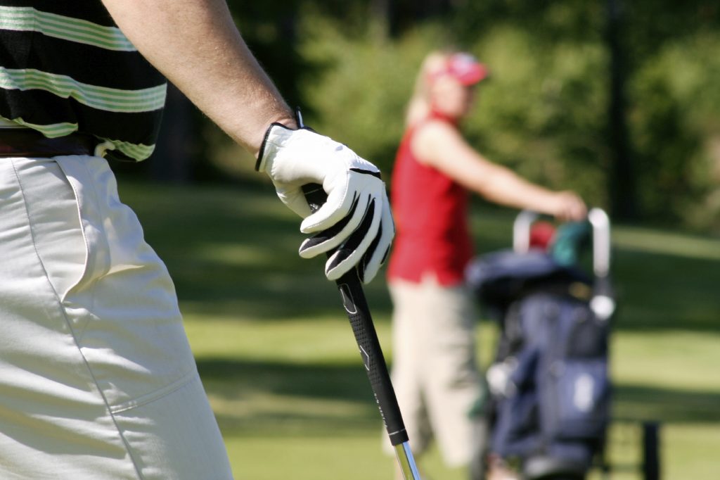 Couple playing golf